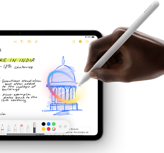 A hand holding Apple Pencil draws a circle around a sketch in the Notes app on iPad
