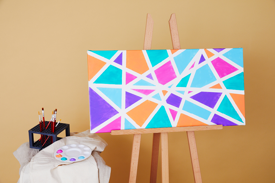 This canvas painting idea is inspired by the art of Piet Mondrian.