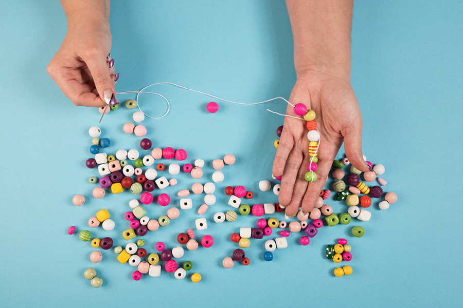 Bead threading is a hypnotic art therapy idea to soothe a busy mind