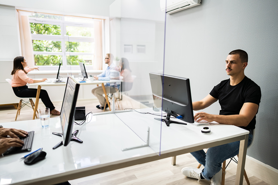 Covid-safe furniture fitouts include individual desks, screens between teammates and larger meeting tables.